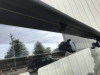 Close-up of the top edge of the Extreme Metal Products cab back under the Yamaha Wolverine X2 roof with knob fasteners