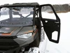 Spike door swung open on a Polaris Ranger XP 1000 parked in snow, front view showing the inside of the door