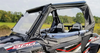 Front three-quarter view of a Polaris RZR 900 with Spike upper doors and a windshield in a field