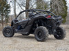 Black Can-Am Maverick X3 with the SuperATV rear bumper installed, rear three-quarter view on gravel