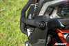 Close-up of the SuperATV front bumper tube end and rubber cap beside the headlight of a Can-Am Maverick X3