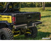 Rear three-quarter view of the SuperATV sheet metal rear bumper on a yellow and black Can-Am Defender in a field