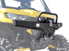 SuperATV diamond plate front bumper with winch and D-ring shackles on a yellow Can-Am Defender, front three-quarter close-up