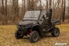Front three-quarter view of a gray Honda Pioneer 1000 with SuperATV full cab enclosure doors and windshield