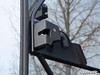 Close-up of the SuperATV door hinge and latch bracket bolted to the Can-Am Defender cab frame