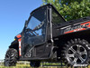 Close side view of the SuperATV full cab door on the red and white Polaris Ranger with the door closed