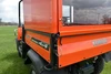 Close rear view of the Wiedmann Bros bed cap tinted glass door above the Kubota RTV 900/1100 tailgate