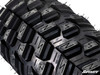 Close-up of the aggressive tread pattern on a SuperATV XT Warrior SlikRok Edition tire