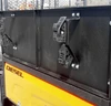 Close-up of the Wiedmann Bros bed wall extender panel with black rubber latches on a Kubota RTV X-Series