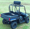 Great Day Power-Ride spare tire rack mounted on the roof cage of a side-by-side holding a spare tire, rear three-quarter