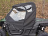 Side X Side full cab enclosure with clear vinyl door window on a green Yamaha Wolverine, driver side view
