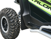 Close-up of the Spike front fender flare over the front tire and door of a green Honda Talon 1000R
