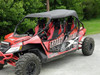 3 Star black soft top installed on a red Arctic Cat Wildcat 4, front three-quarter view on pavement