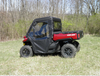 Rear three-quarter view of a red Can-Am Defender with the 3 Star cab enclosure and rear window installed