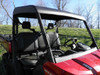 3 Star soft top with hard windshield on a red Can-Am Defender, front three-quarter close-up with no doors fitted