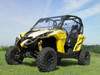 3 Star two-piece windshield on a yellow Can-Am Maverick, front three-quarter view on grass