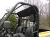 Driver side view through the cage of the 3 Star rear window panel behind the seats of a Cub Cadet Challenger
