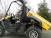 Side view of a yellow Cub Cadet Challenger 500 with the bed raised, showing the 3 Star rear window panel behind the cab