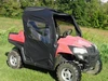 3 Star full cab enclosure with clear soft windows installed on a red Hisun 500/700, front three-quarter view on grass