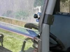 Close-up of the 3 Star one-piece windshield clamp at the roll cage of a Hisun HS800
