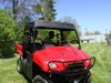 Driver-side front view of the Honda Big Red wearing the 3 Star soft top on a sunny lawn