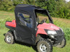 3 Star black soft doors and rear window installed on a red Honda Big Red, front three-quarter view in a field