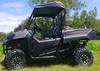 3 Star black soft top installed on a green Honda Pioneer 700-2, side view in a grassy field