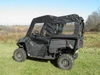 Side view of a Honda Pioneer 700-4 with the 3 Star soft doors and rear window combo installed
