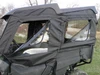 Close side view of both 3 Star soft doors with clear windows on a Honda Pioneer 700-4 under its roof