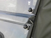 Close-up of the 3 Star two-piece windshield edge clamps and knobs beside the soft door of a Honda Pioneer 700-4