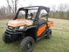Driver side front three-quarter view of the orange Pioneer 1000 with 3 Star soft upper doors and clear windows