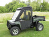 3 Star soft doors and rear window combo on a green John Deere Gator XUV, driver side front three-quarter view in a field