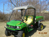 3 Star soft top in camo on the green John Deere Gator HPX/XUV, front three-quarter view showing the color option