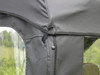 Close-up of the 3 Star cab enclosure door zipper and clear vinyl window panels on the John Deere Gator XUV-4
