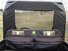 3 Star soft back panel with clear window seen from the cargo bed of a John Deere Gator, with a storage bag in front