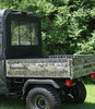 3 Star black soft back panel with window installed behind the cab of a camo Kawasaki Mule, rear corner view