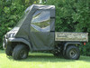 3 Star black soft doors and top installed on a Kawasaki Mule with camo bed, side view on a lawn
