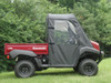 Side view of the red Kawasaki Mule 4000/4010 with the 3 Star soft door closed and the cargo bed behind