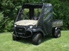 Front three-quarter view of a camouflage Kawasaki Mule SX wearing the 3 Star full cab enclosure