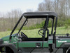 Side view of the 3 Star soft top edge and roll cage on the green Kawasaki Mule Pro FX/DX with trees behind