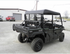 Rear three-quarter view of the black six-seat Kawasaki Mule crew wearing the 3 Star soft top