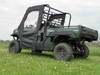 Side view of a Kawasaki Mule ProFX with the 3 Star enclosure door closed and rear panel rolled up