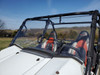 3 Star one-piece scratch-resistant windshield on a white Kawasaki Teryx, front three-quarter close-up in a field