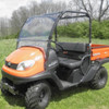 Driver side front three-quarter view of an orange Kubota RTV with the 3 Star 2-piece windshield fitted