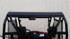 Rear view of the Extreme Metal Products aluminum top over the cage and seats of the Honda Pioneer 500 in a garage