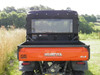 3 Star soft rear window panel with clear vinyl installed behind the cab of an orange Kubota RTV1140, rear view