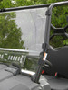 Side view of the 3 Star two-piece windshield clamped to the cage of a Kymco 450 with lower vent slots open