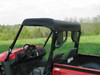 Side view of the 3 Star soft top over the cab of the red Kymco 700 showing the steering wheel and cargo bed