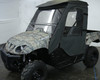 Camo Yamaha Rhino in a studio with the 3 Star two-piece windshield inside a full soft cab enclosure, front three-quarter