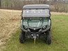 Front view of a green Yamaha Viking with 3 Star two-piece windshield installed, parked in a field